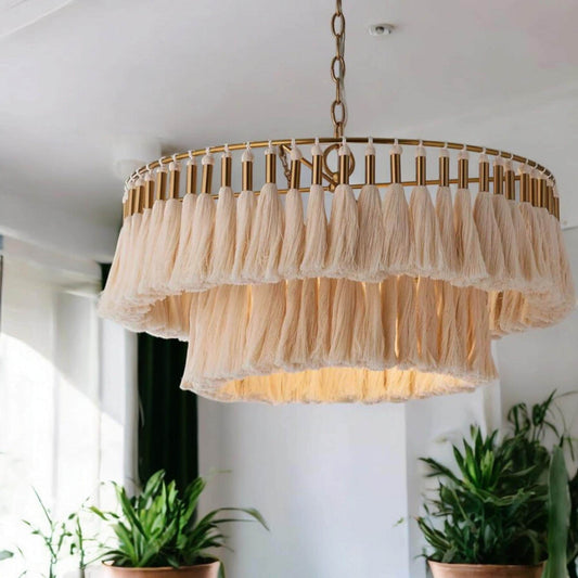 handmade, modern and elegant natural macrame chandelier. This chandelier, measuring 35 cm in diameter, is ideal for creating a warm and stylish atmosphere in interiors. Its gold details perfectly match industrial styles.
