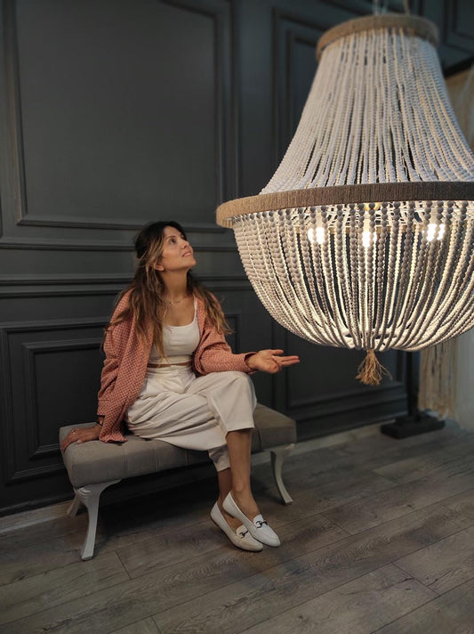 "Handcrafted wooden bead chandelier, 80 cm in diameter, ideal for boho and rustic decor. Creates a warm atmosphere with its elegant, curved design. Made from high-quality natural materials, it complements modern, farmhouse, or coastal-themed decor."