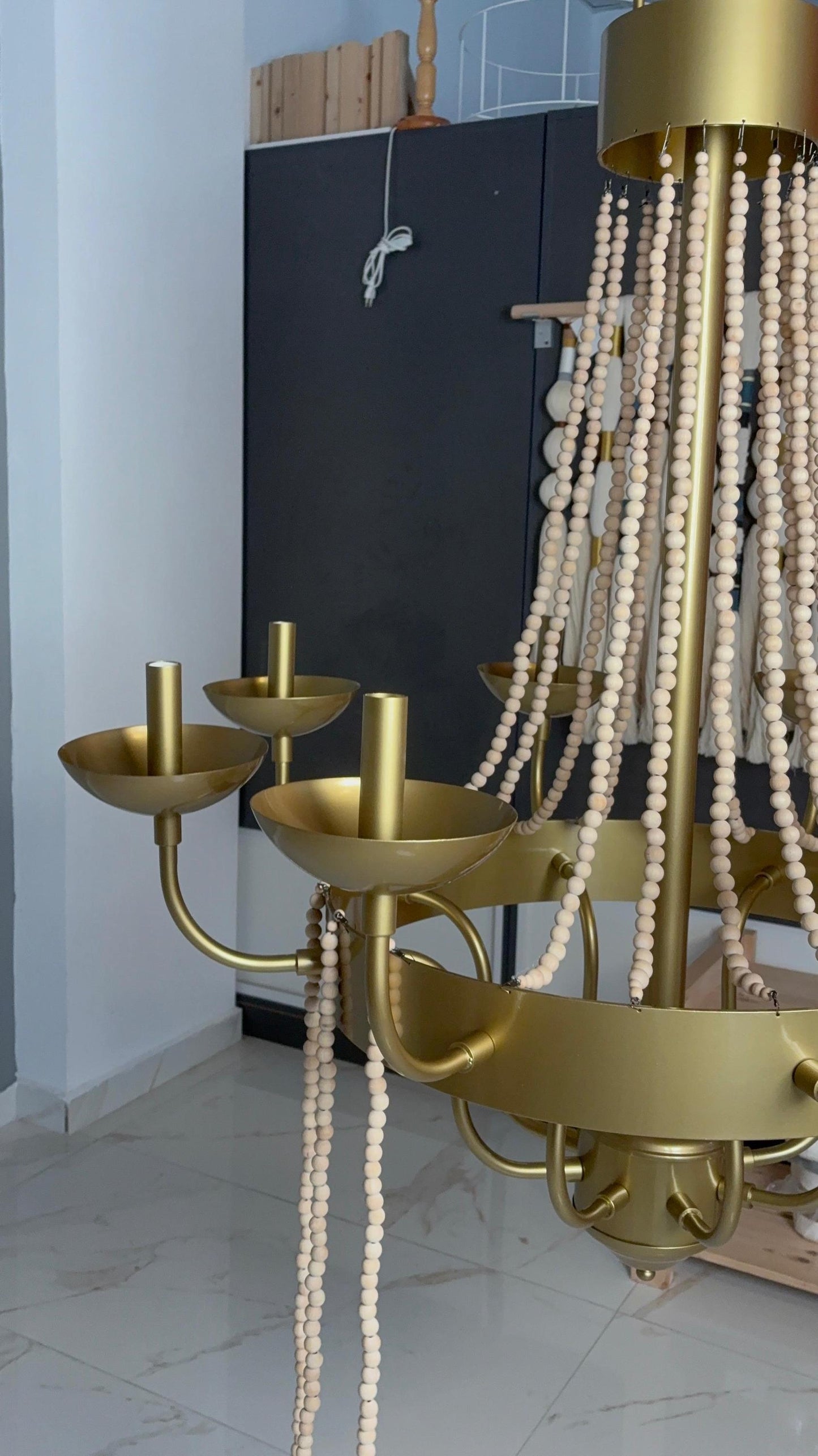 Black metal candle chandelier with wood bead drapes”


3. “White beaded chandelier for rustic modern dining room”


4. “Handmade large candle chandelier holiday home lighting”