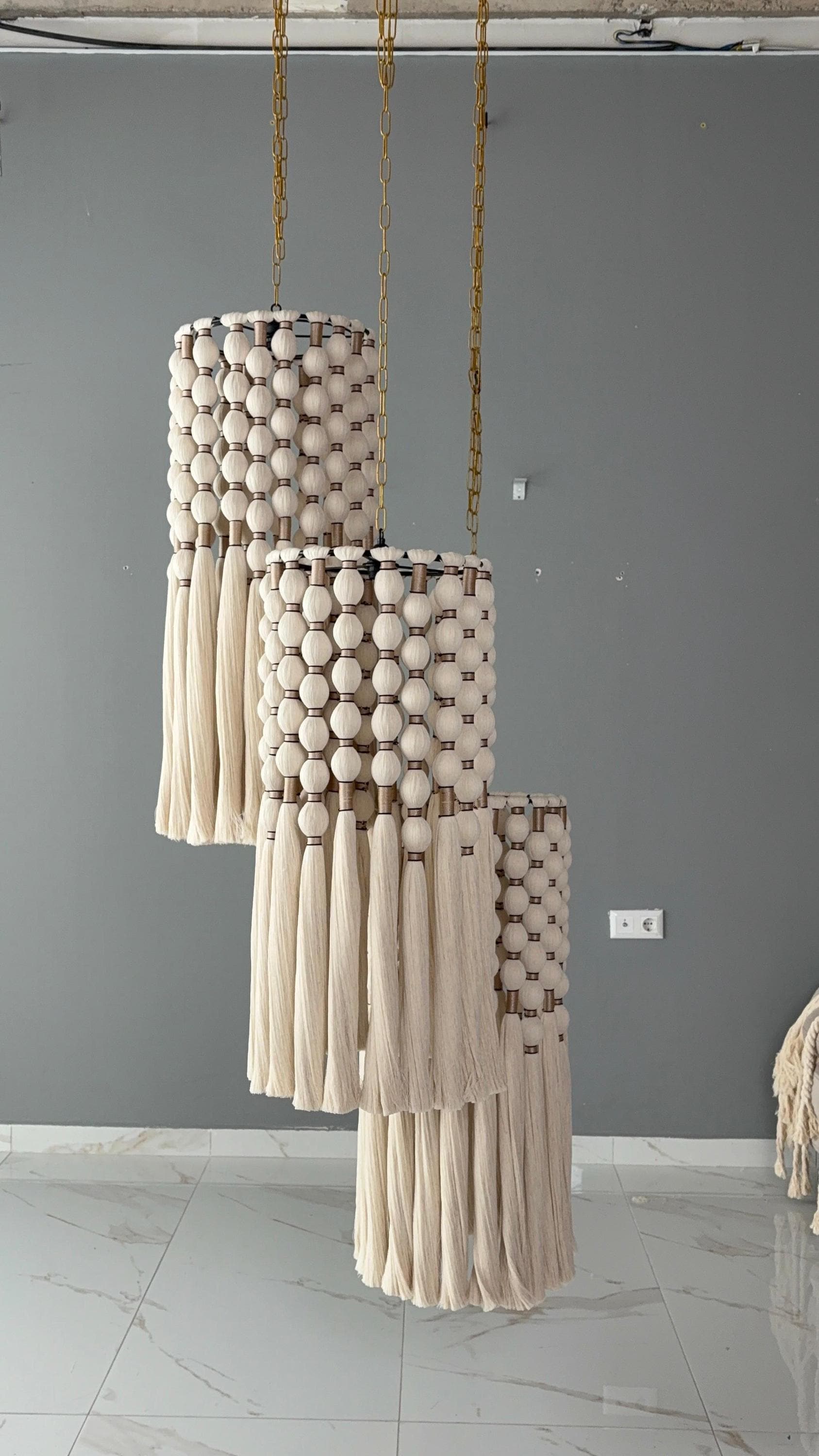 cord knitted with cotton yarn, single-connected 3-lamp pendant lamp, brass plate, beaded cord.