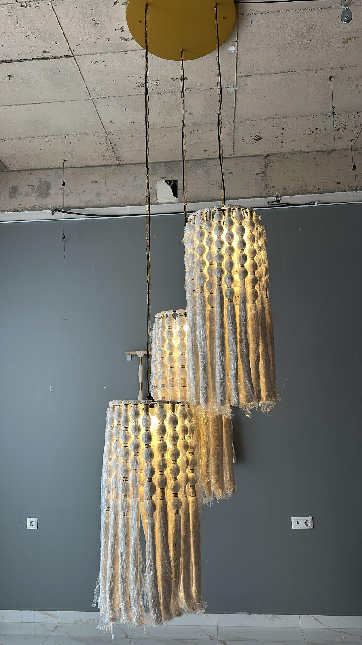 cord knitted with cotton yarn, single-connected 3-lamp pendant lamp, brass plate, beaded cord.