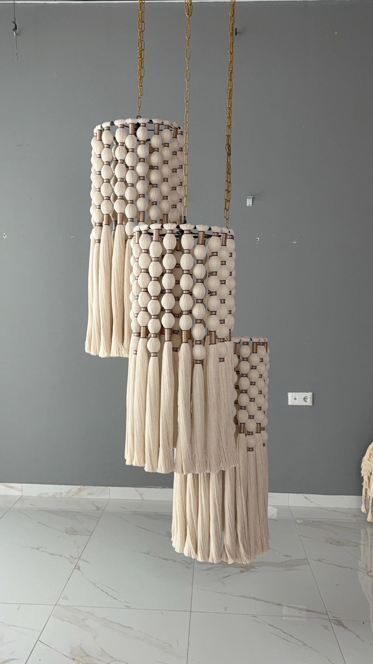 cord knitted with cotton yarn, single-connected 3-lamp pendant lamp, brass plate, beaded cord.