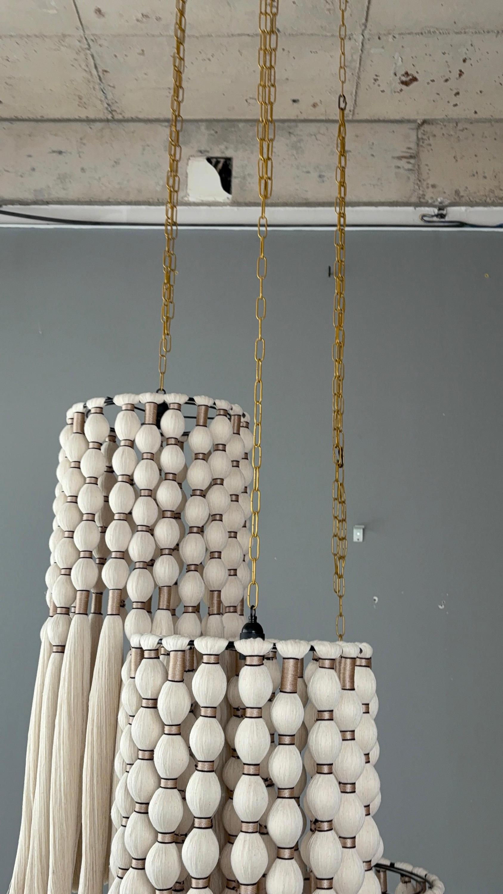 cord knitted with cotton yarn, single-connected 3-lamp pendant lamp, brass plate, beaded cord.