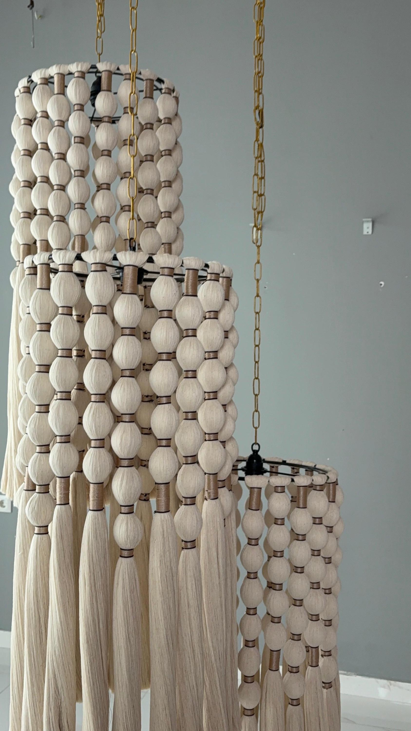 cord knitted with cotton yarn, single-connected 3-lamp pendant lamp, brass plate, beaded cord.